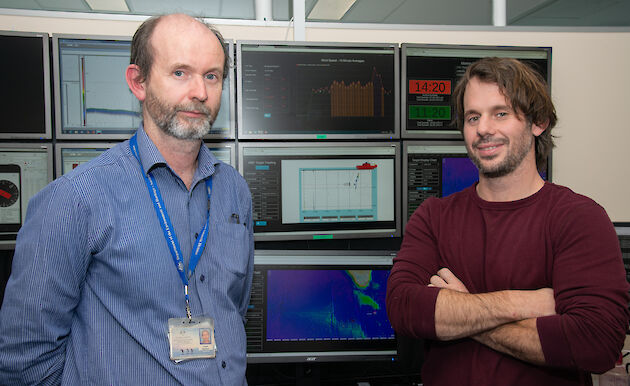 Lloyd Symons (left) and Michael Santarossa in front of computer screens set up to mimic the Aurora Australis science control room and deliver ‘data in real time’ (DiRT).
