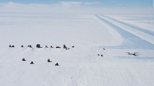 Photo of blue ice runway with plane
