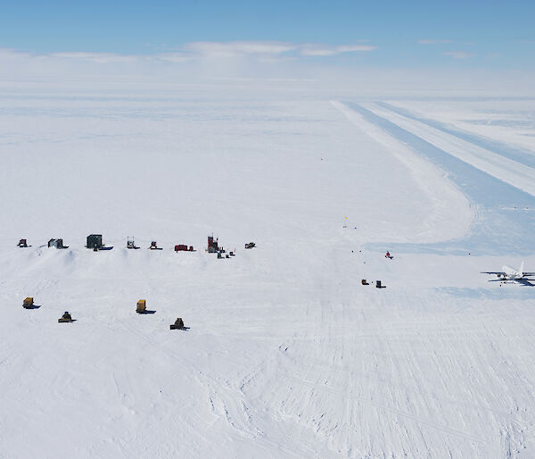 Photo of blue ice runway with plane