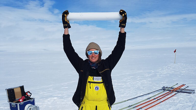 PhD student Madi Gamble Rosevear holding an ice core on the Totten Glacier, near Australia’s Casey research station