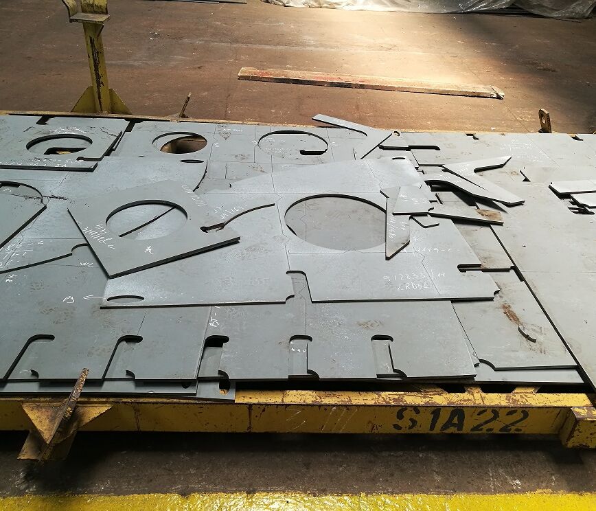 Pieces of steel plate cut into shapes.