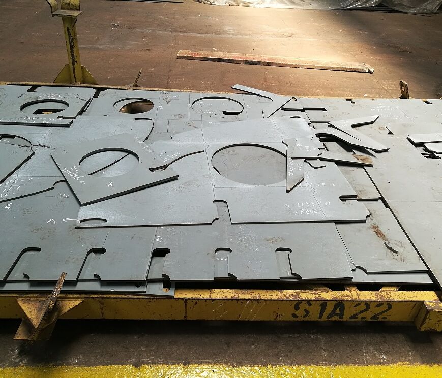 Pieces of steel plate cut into shapes.