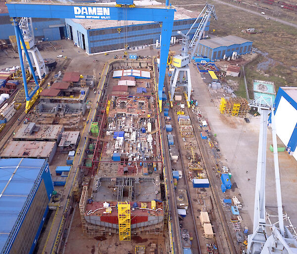 The base of the ship’s hull takes shape in the dry dock at Damen Shipyards in Romania