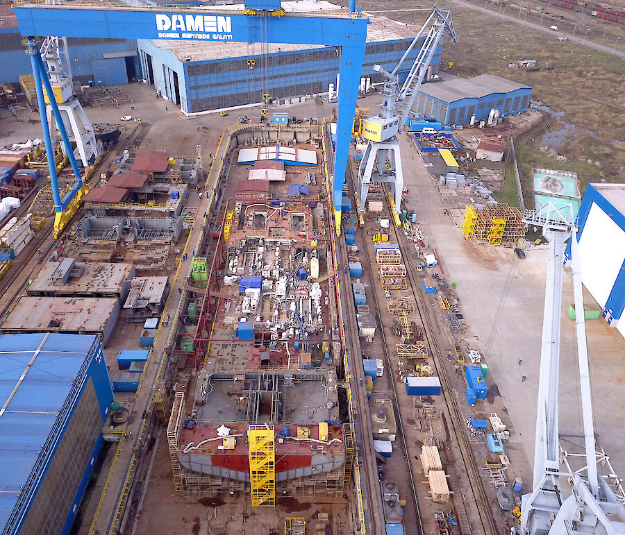 The base of the ship’s hull takes shape in the dry dock at Damen Shipyards in Romania