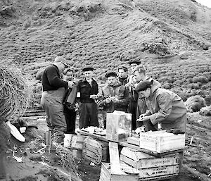 Group of people sitting and eating.