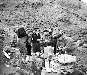 Group of people sitting and eating.