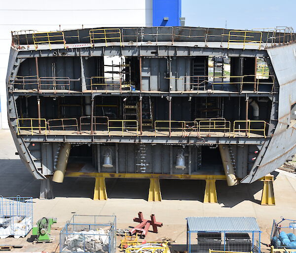 A 300 tonne steel block of the ship’s hull showing anchor tubes and three decks.