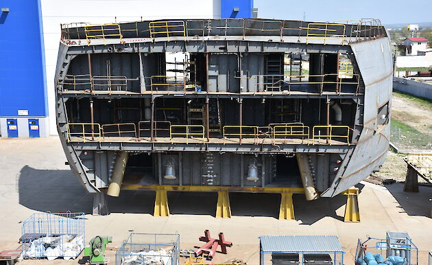 A 300 tonne steel block of the ship’s hull showing anchor tubes and three decks.