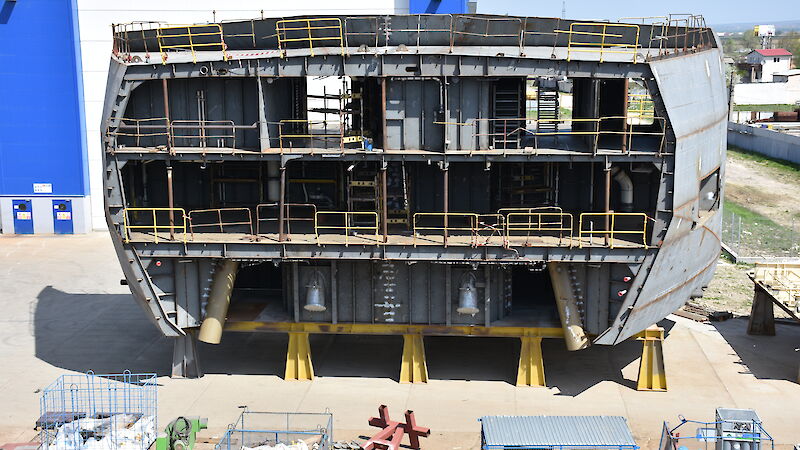 A 300 tonne steel block of the ship’s hull showing anchor tubes and three decks.