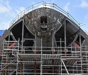 Bow of the ship with scaffolding surrounding it.