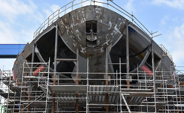 Bow of the ship with scaffolding surrounding it.