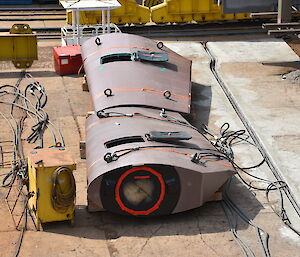 Two rudders waiting to be installed on the ship.
