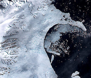 Satellite image of sliver icebergs calving off the Larsen B Ice Shelf on February 17, 2002.