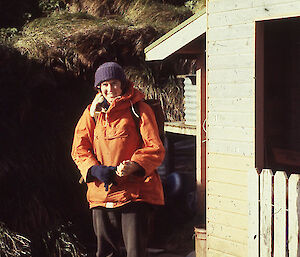 Women in orange with backpack on