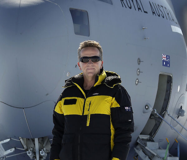 Dr Nick Gales with the RAAF C-17A Globemaster III in the background at Australia’s Wilkins Aerodrome