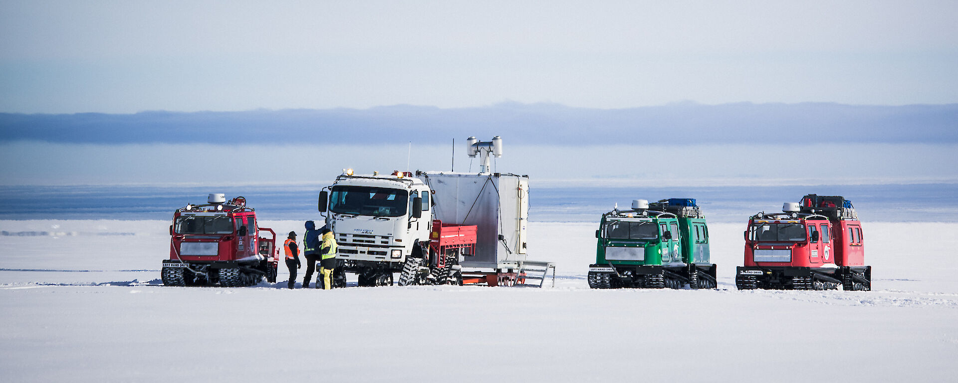 Expeditioners at Australia’s Casey research station preparing for C-17A Globemaster III airdrop