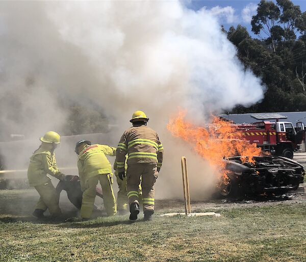 Expeditioners save a mock patient from the flames