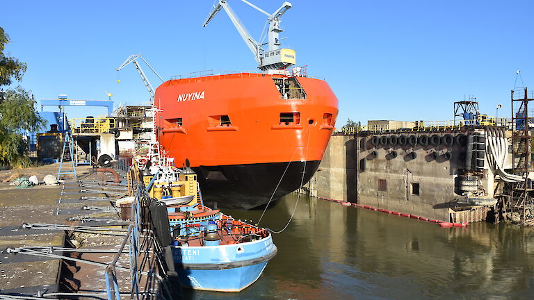 The ship in the wet dock being prepared to move out into the River Danube.