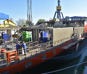 The Nuyina’s name panel is in place above the watertight hull, as other components of the superstructure (area above the hull) are being prepared for installation.