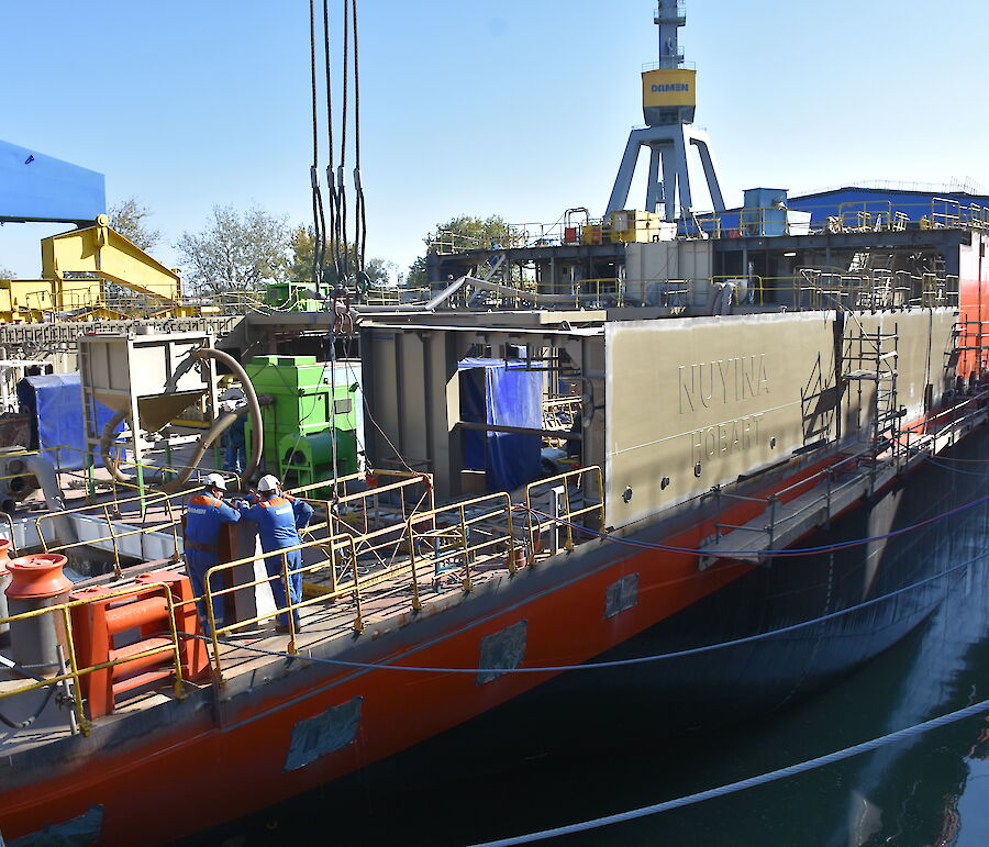 The Nuyina’s name panel is in place above the watertight hull, as other components of the superstructure (area above the hull) are being prepared for installation.