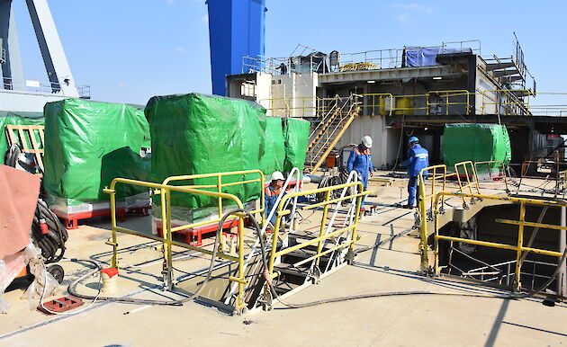 Expeditioner and crew cabins will have an ensuite with shower, toilet and basin, shown here with green protective covers being installed on Deck 6.