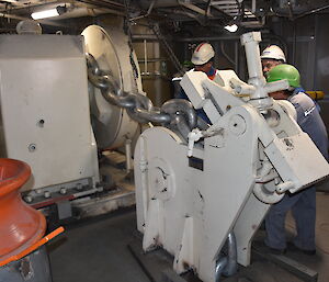 An anchor windlass and chain stopper.
