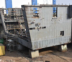 The upside-down helicopter hangar under construction in the drydock.