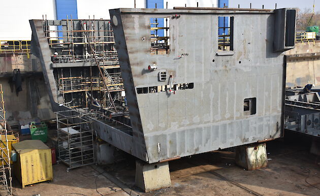 The upside-down helicopter hangar under construction in the drydock.