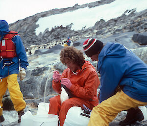 Man with Adelie penguin