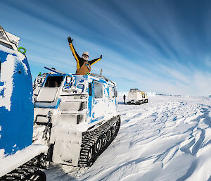 Expeditioner in a tracked over-snow vehicle called a Hägglunds