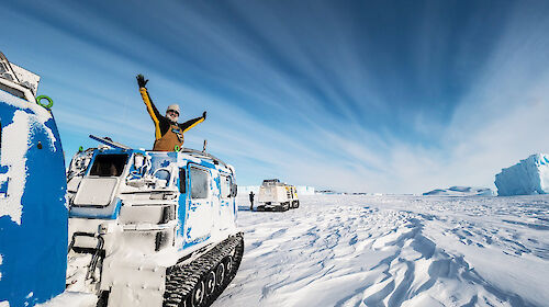 Expeditioner in a tracked over-snow vehicle called a Hägglunds
