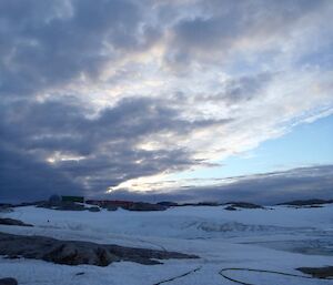 Fuel line running to upper fuel farm across ice.