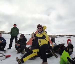 Expeditioners melt snow for a cup of tea