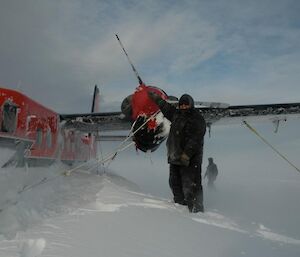 Kevin in front of Twin Otter aircraft