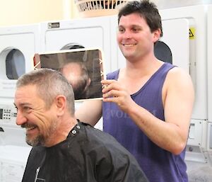 Expeditioner getting a haircut
