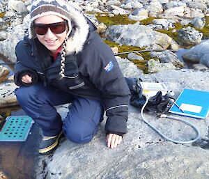 Scientist collects moss samples