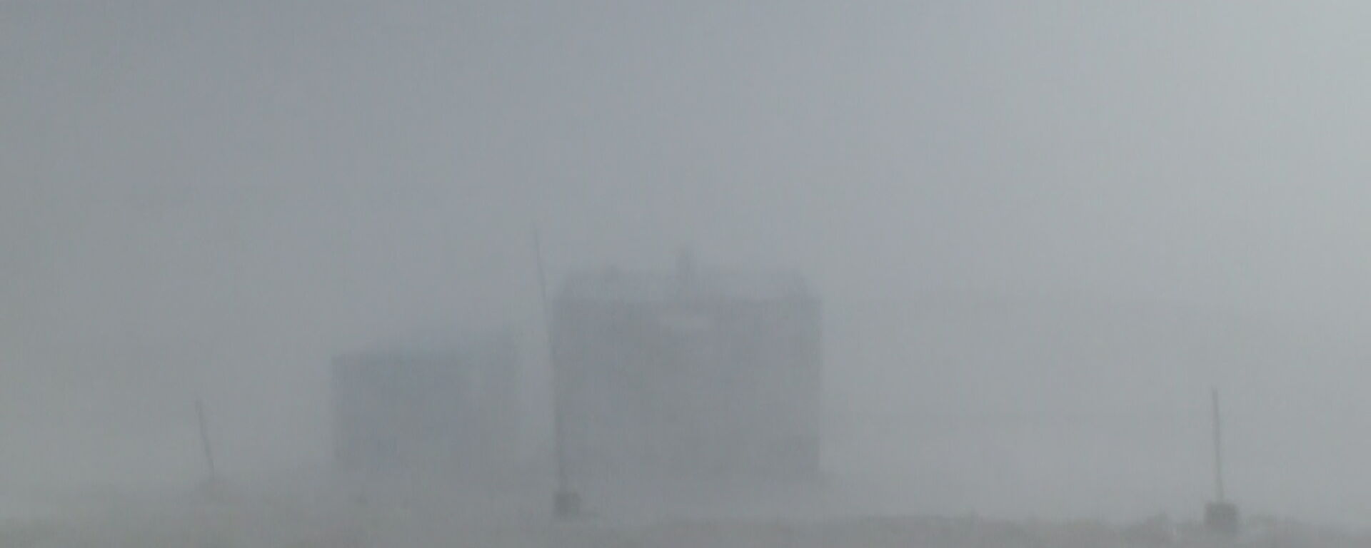 A building is barely-visible through a record blizzard