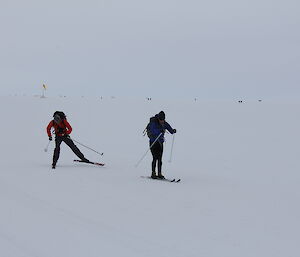 Beck showing James how to ski