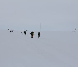 Off and racing — silhouettes of participants surrounded by white