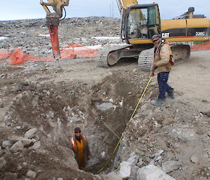 Digging down to bedrock on the SE corner. Gary Mason in the hole and Johan Metz above