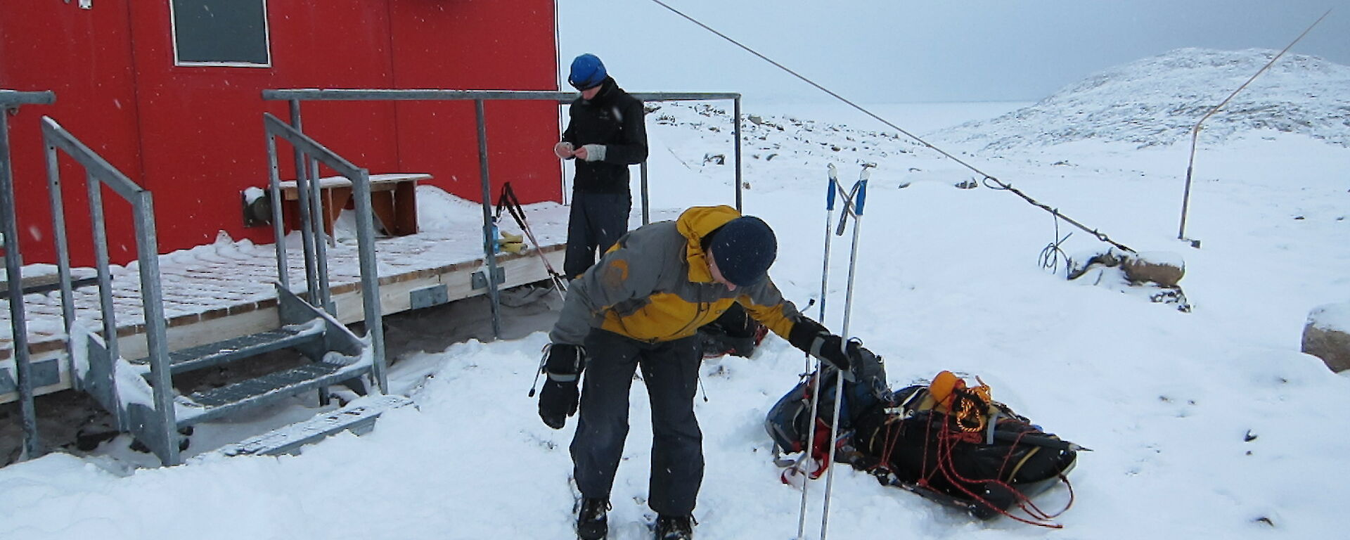 Gav outside of the hut on skis