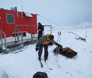 Gav outside of the hut on skis