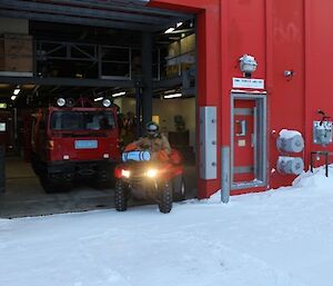 SAR Training Casey, quad being driven out of the red shed