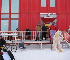 Relay for Life expeditioners outside the Red Shed, resting