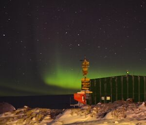 Aurora with shed in foreground