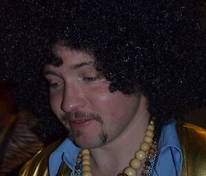 Craig dressed with black afro