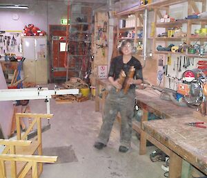 Misty making new book shelves for the office in the woodworking shop