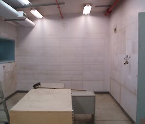 Painting workshop office at Casey with walls primed in white paint