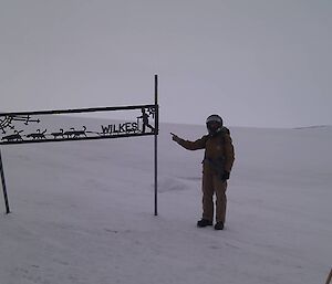 Jamie Lowe poses with Wilkes sign