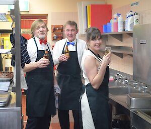 Jon, Dave and Misty in the kitchen, getting ready to serve dinner